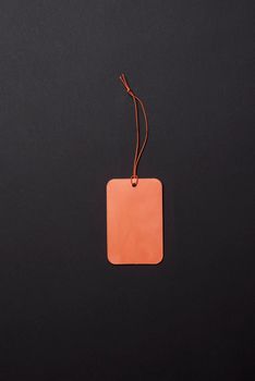 Black friday concept. An empty shopping tag on dark background