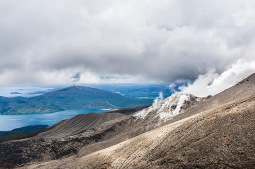 Lake Rotoaira seen from steaming volcanic slope of Mt. Tongariro on Tongariro Crossing national park. North Island, New Zealand