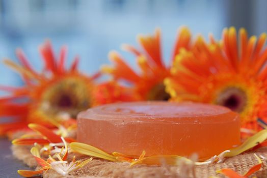 Homemade soap with dried flower on table ,