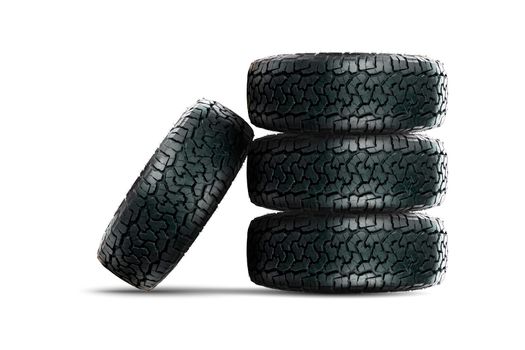 Stack of 4 wheels car tires designed for use in all road conditions with alloy wheel isolated on white background.