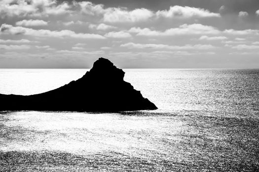 Silhouette of little islet of Siren Reef in Cabo de Gata-Nijar Natural Park, Almeria, Spain.