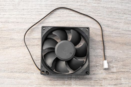 Cooling fan for power electronics radiator with power cable.