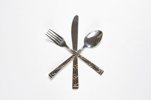 Restaurant eating items - Fork, spoon and knife on white background