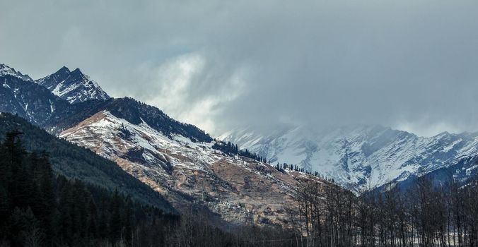 Landscape of mountain range covered with snow in Manali during summers