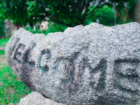 Beautiful stones of nature garden or park decorated with natural stones, decorated with trees, grass and flowers environment greenery concept