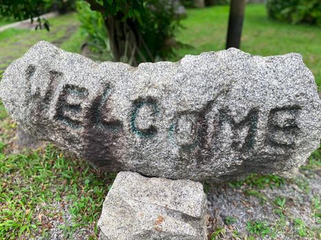 Beautiful stones of nature garden or park decorated with natural stones, decorated with trees, grass and flowers environment greenery concept