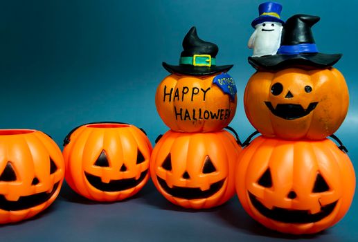 Jack o lantern pumpkin on a dark blue background. Halloween concept backdrop