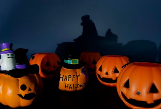 Beautiful jack o lantern pumpkin on a dark background. Halloween concept backdrop