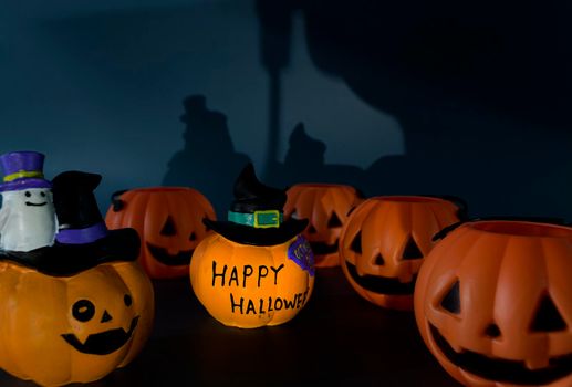 Beautiful jack o lantern pumpkin on a dark background. Halloween concept backdrop