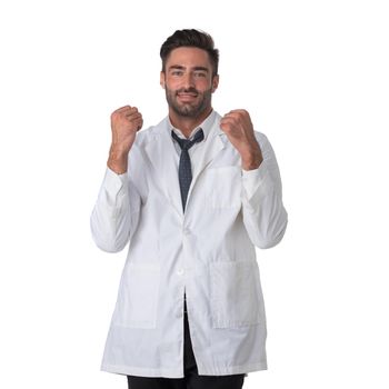 Portrait of doctor man holding fist success sign isolated on white background