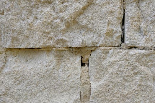 Close-up on the light brick wall of the building, background