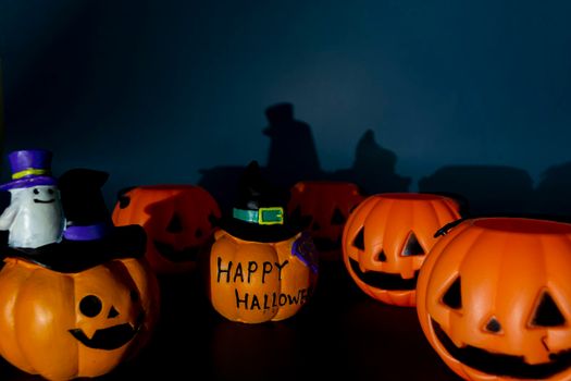 Beautiful jack o lantern pumpkin on a dark background. Halloween concept backdrop