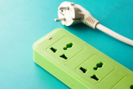 Electrical switch and plug on color background