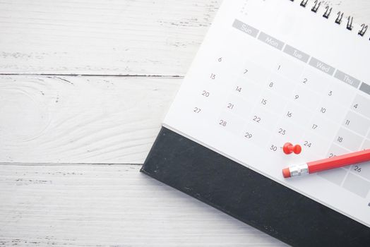 deadline concept with push pin on calendar date close up .