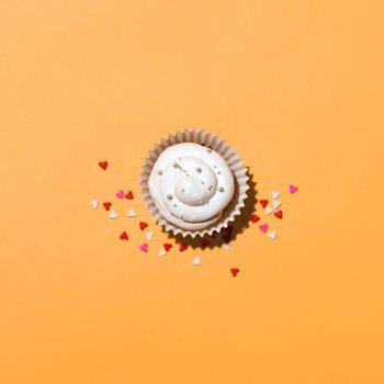 Birthday cupcake against a yellow background