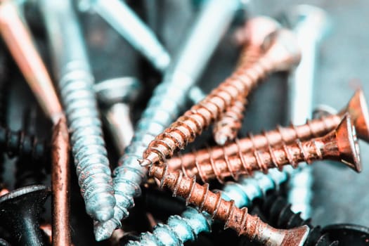 Different Kind of Screws on a table in a workshop