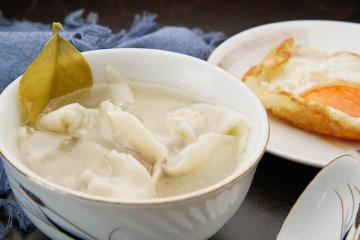 Dumpling Soup in a bowl on table