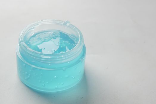 hand hold a jar of hair gel