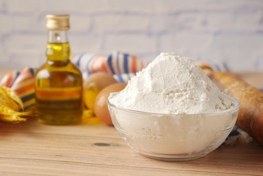 wheat flour in a bowl on table ,