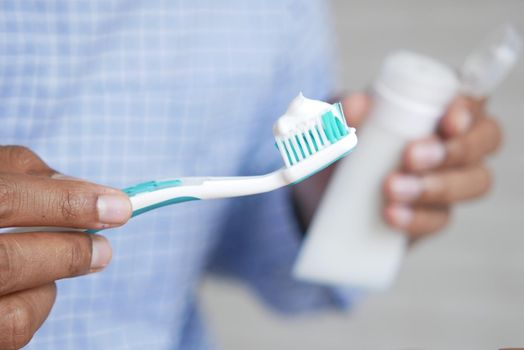 hand holding tooth brush with copy space