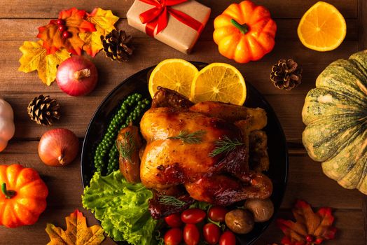 Thanksgiving roast turkey or chicken and vegetables, Top view Christmas dinner feast food decoration traditional homemade on wooden table background, Happy thanksgiving day of holiday concept