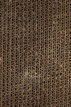 Used cat scratcher texture. Cat cardboard toy for scratching and playing. Close up view.