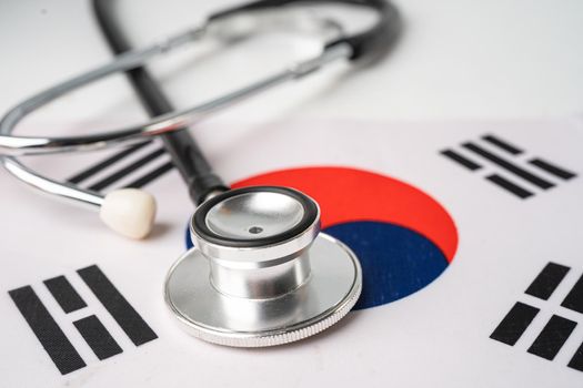 Stethoscope on Korea flag, check problem of business and finance concept.