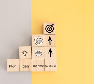 Icon for business on wooden block of plan, idea, income and success