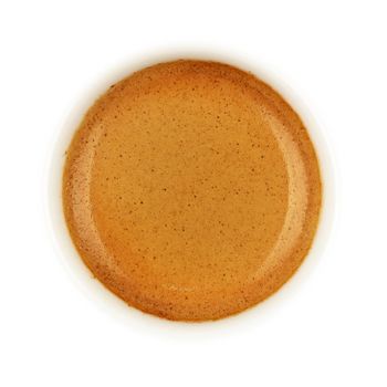 Close up espresso coffee brown crema froth in white cup isolated on white background, elevated top view, directly above
