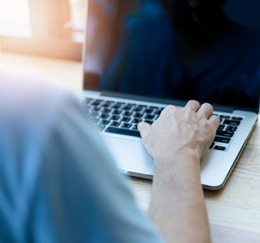 Hand man use laptop for work from home