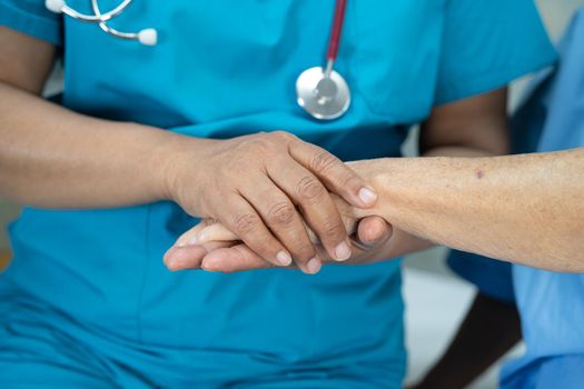 Holding hands Asian senior or elderly old lady woman patient with love, care, encourage and empathy at nursing hospital ward, healthy strong medical concept