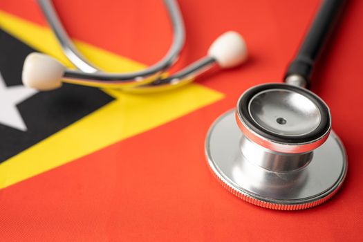 Black stethoscope on East Timor flag background, Business and finance concept.