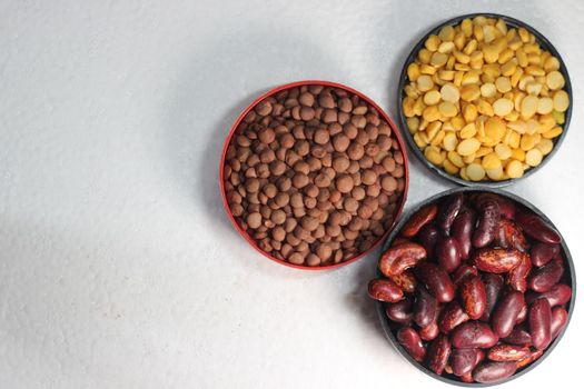 Top view of assortment of cereals, and cardamom. Collection of different spices and cereals.