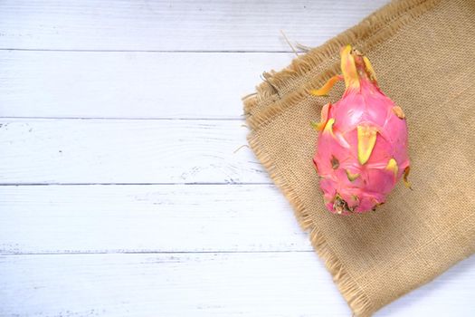 slice of dragon fruit on a table with copy space .