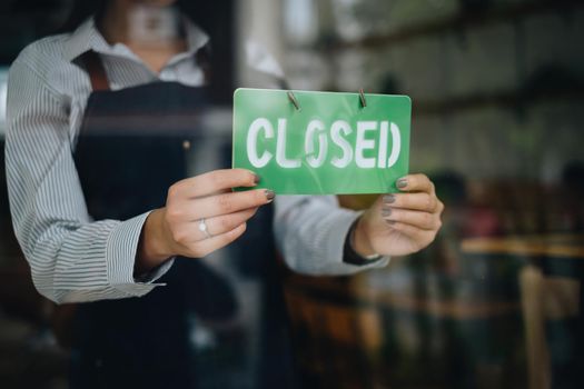 Store Owner Turning Closed. Stressed owner forced to close the coffee shop permanently due to restrictions on the COVID-19