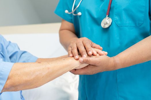 Holding hands Asian senior or elderly old lady woman patient with love, care, encourage and empathy at nursing hospital ward, healthy strong medical concept