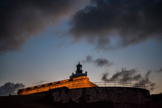 Castillo San Felipe del Morro of San Juan, Puerto Rico, a castle fortress at sunset. Generations of soldiers lived at the fort and visitors today are inspired by the stories and architecture.