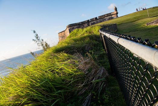 Abstract view of the castle in San Juan, Puerto Rico at sunset. Generations of soldiers lived at the fort and visitors today are inspired by the stories and architecture.