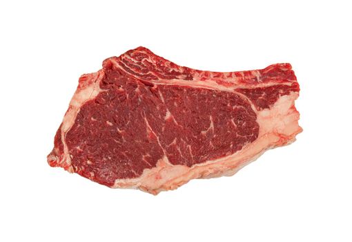 Close up one marbled raw ribeye beef steak with rib bone isolated on white background, elevated top view, directly above
