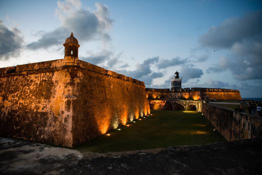 Castillo San Felipe del Morro of San Juan, Puerto Rico, a castle fortress at sunset. Generations of soldiers lived at the fort and visitors today are inspired by the stories and architecture.