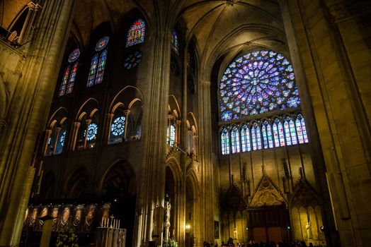 Paris, France - February 3, 2017: Stained glass window of the Notre Dame cathedral where the kings of France were crowned