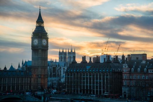 London, UK - February 4, 2017: The Big Ben Clock tower of Parliament with a heavenly blue and yellow sunset.