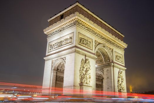 Paris, France - February 3, 2017: Paris Arc de Triomphe long exposure with traffic lights. Majestic Structure