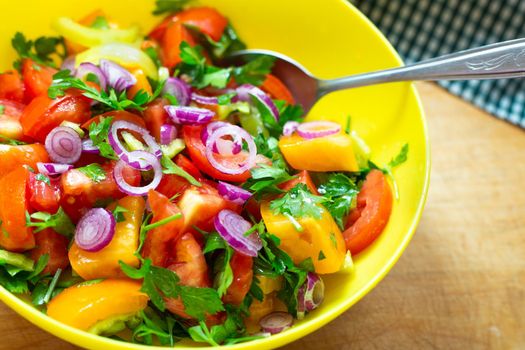 Vegetable salad in a cup. Cooking tomato, pepper and onion snacks.