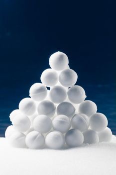 snowballs heap on dark blue background