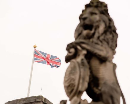 London, UK - January 29, 2017: A detail photo of the Victoria Memorial including a unicorn and lion statue outside of Buckingham Palace in London.