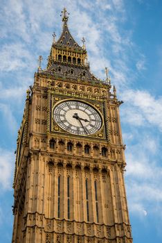 London, UK - February 4, 2017: Close up detail view of the Big Ben clock tower where you can see the time and the unique structure of the iconic architecture.
