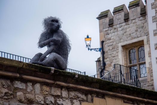 London, UK - January 27, 2017: A close up of the Royal Menagerie monkey statue at the Tower of London Castle.