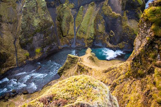 Fjaorargljufur, Iceland mossy green canyon with breathtaking views. Closeup of the river from the top.