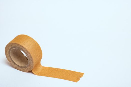 Adhesive plaster isolated on a white background close up, copy space